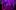 A path in a forest lined by trees cast in purple and red lights