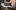 cropped view of african american man writing something on paper in clipboard