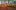 Round table with orange cloth and centerpiece, rectangular table with candles and floral decor.